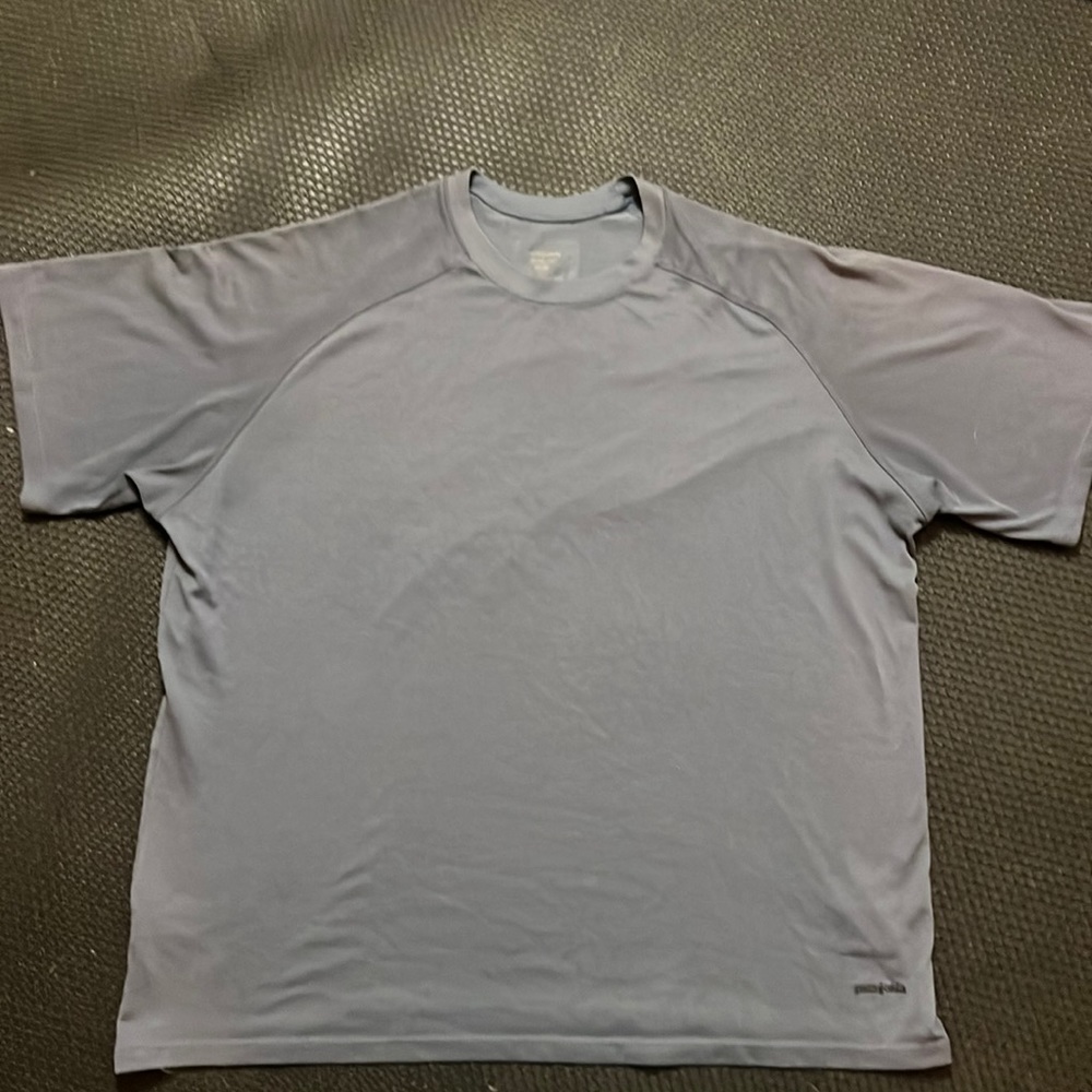 Mens Patagonia capilene short sleeve in a grey blue